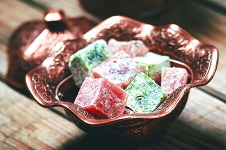 Turkish delight (lokum) in traditional oriental carved patterned metal plateの写真素材
