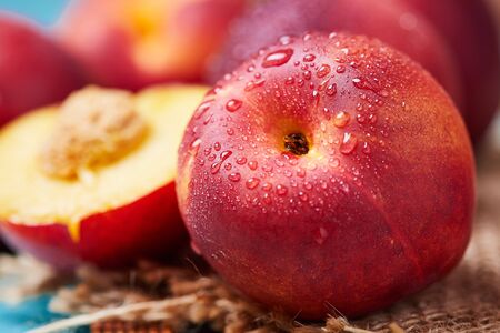 Close up of fresh ripe nectarines with water dropsの写真素材