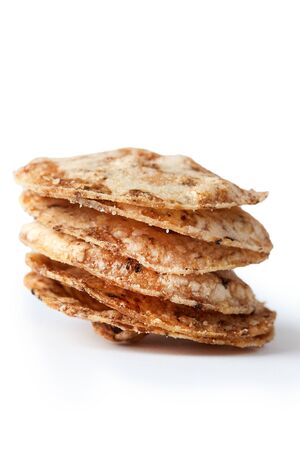 Brown rice chips isolated on white background. Healthy crispy snackの写真素材