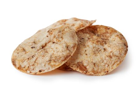 Brown rice chips isolated on white background. Healthy crispy snackの写真素材