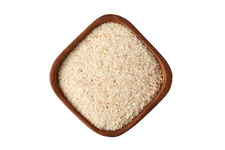 Psyllium (ispaghula) husk in wooden bowl isolated on white background. Top viewの写真素材