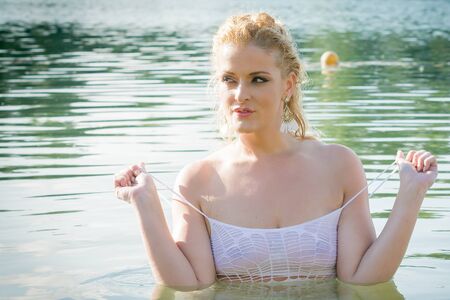 Pretty girl in waterの写真素材