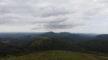 Panoramic aerial view of mountains and valleys in the distance.