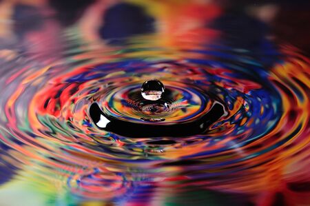 Colorful droplet of water on a reflected on artist's palleteの写真素材