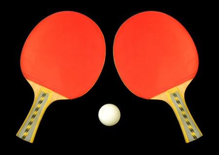 Table tennis double paddle and ball over blackの写真素材