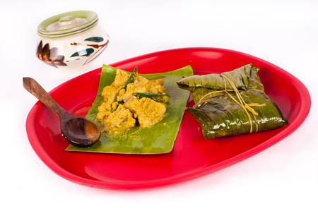 Delicious fish paturi dish wrapped in banana leaf in traditional Indian styleの写真素材