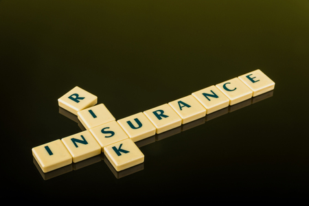 Business concept of risk management by insurance using letter blocksの写真素材