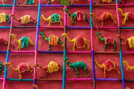 Many colorful hand made toy camels made of silk cloth for sale at Jaisalmer, Rajasthanの写真素材