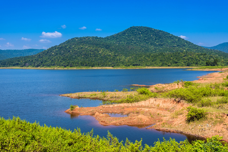 Deep blue water of Burudih lake with mountains in the backdrop at Ghatsila, Jharkhand, Indiaの写真素材