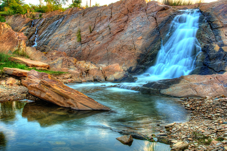 High dynamic image of Ghatsila falls flowing into Subarnarekha river in Ghatsila, Jharkhand, Indiaの写真素材