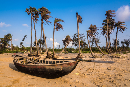 Wooden fishing boat in a beach in Mandarmoni by bay of bengal sea.の写真素材