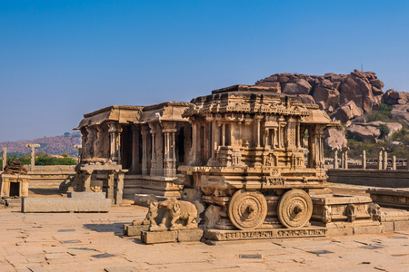 Famous stone chariot in Vittala temple well known for its exceptional architecture in Hampi, India. These ruins are from the Hindu Vijayanagara empire which existed in the 14th century.の写真素材