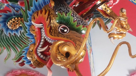 Swagger big dragon claws outstretched. With big eyes and big fangs and long-HT has crested. A mirror and a long tongue mouth wide variety of colors including red, green and blue scales interchangeablyのeditorial素材