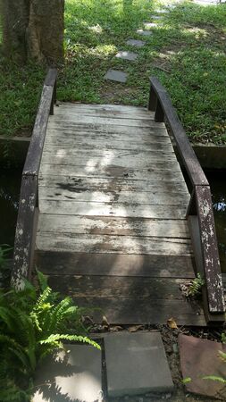 Small wooden bridge wooden small plates with handrails on both sides.の写真素材