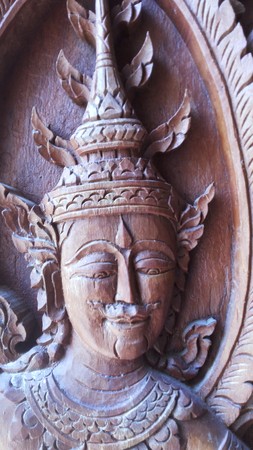 Angels handsome face Carved out of wood On the head with ornaments Body jewelry Thailand is an art class Carved out the window. Of a churchのeditorial素材