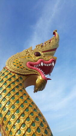 serpent statue golden scalesの写真素材