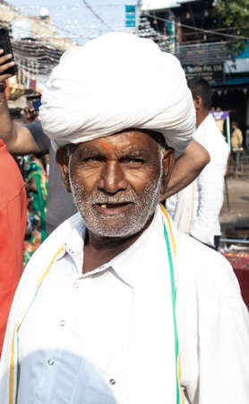 Pushkar,Rajasthan /India. 06 /11/2019. Rajashtan old Man with wrinkles on face in White Traditional...