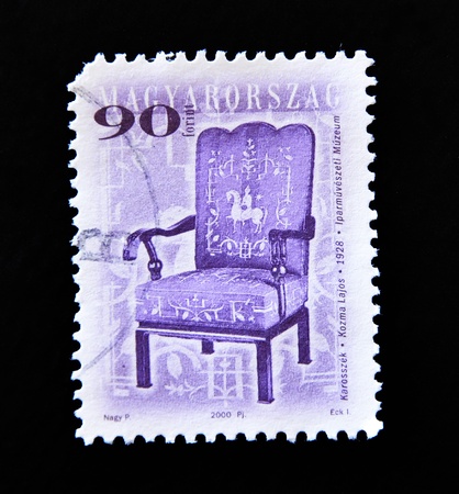 HUNGARY - CIRCA 2000: A post stamp printed in Hungary shows antique chair, circa 2000 の写真素材
