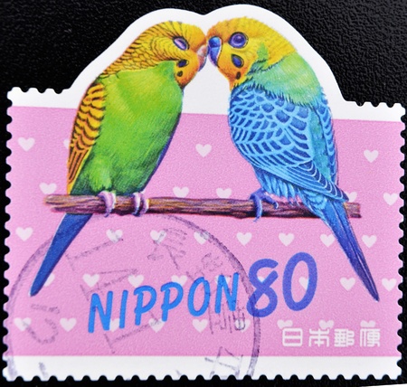 JAPAN - CIRCA 2000: A stamp printed in Japan shows two parrots, circa 2000 の写真素材