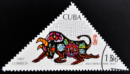 CUBA - CIRCA 1997: A stamp printed in Cuba shows ox commemoration of the Chinese Lunar Year, circa 1997 の写真素材