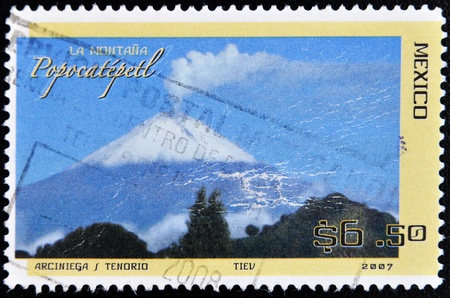 MEXICO - CIRCA 2007: A stamp printed in Mexico shows the Popocatepetl volcano, circa 2007 のeditorial素材