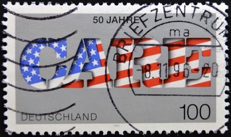 GERMANY- CIRCA 1995: A stamp printed by Germany, shows text care 50th anniversary, circa 1995. の写真素材