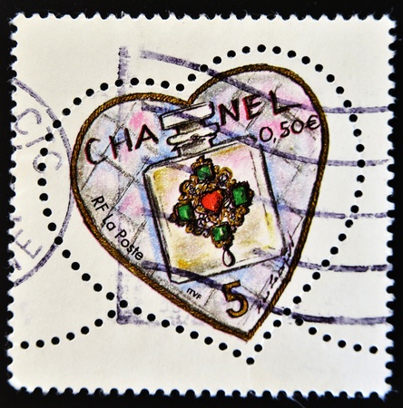 FRANCE - CIRCA 2003: A stamp printed in France shows Chanel perfume in a heart, circa 2003 のeditorial素材