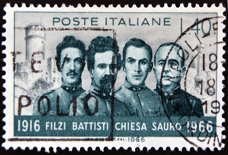 ITALY - CIRCA 1966: A stamp printed in Italy shows Filzi, Battisti, Chiesa and Sauro, fighters of the First World War, circa 1966の写真素材