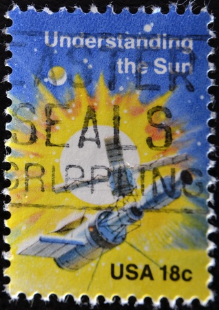UNITED STATES OF AMERICA - CIRCA 1981: A stamp printed in USA shows understanding the Sun, circa 1981の写真素材