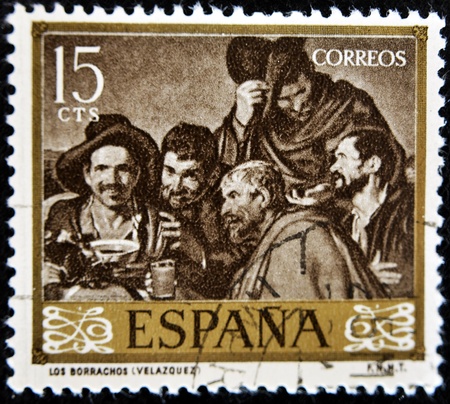 SPAIN - CIRCA 1959: A stamp printed in spain shows the box "drunkards" by Diego Velazquez, circa 1959 のeditorial素材