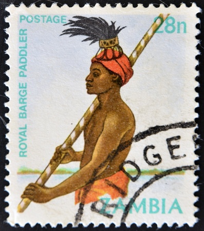 ZAMBIA - CIRCA 1991: A stamp printed in Zambia shows a Royal Barge Handler, circa 1991の写真素材