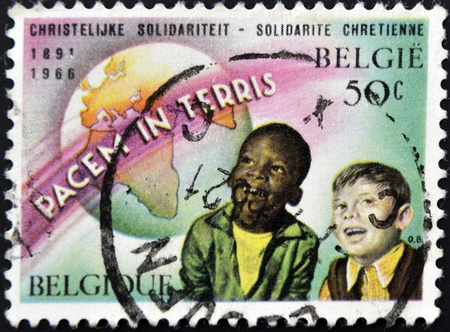 BELGIUM - CIRCA 1966: A stamp printed in Belgium dedicated to peace on earth , circa 1966の写真素材