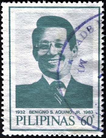 PHILIPPINES - CIRCA 1986: A stamp printed in Philippines shows Benigno Aquino, husband of Corazon Aquino, circa 1986のeditorial素材