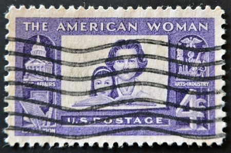 UNITED STATES OF AMERICA - CIRCA 1960: a stamp printed in the USA shows Mother and daughter, dedicated to american women, circa 1960 の写真素材