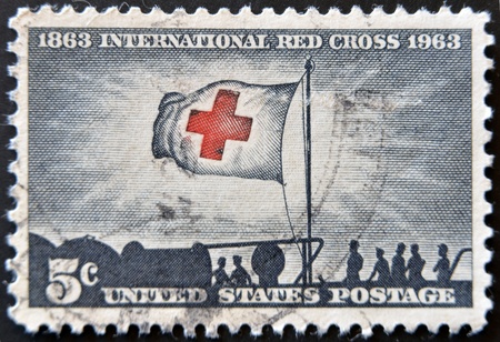 Stock Photo:   UNITED STATES - CIRCA 1943: stamp printed by United states, shows Flag of Red Cross, circa 1943 のeditorial素材