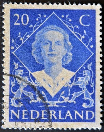 NETHERLANDS - CIRCA 1948: A stamp printed in the Holland shows image of Queen Juliana, circa 1948 のeditorial素材