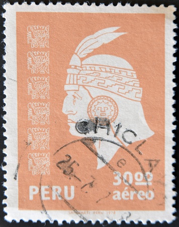 PERU - CIRCA 1978: A stamp printed in Peru shows the face of an Inca Indian, circa 1978 の写真素材