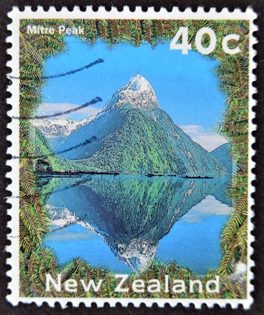 NEW ZEALAND - CIRCA 2002: A stamp printed in New Zealand shows image of Mitre Peak, circa 2002 の写真素材