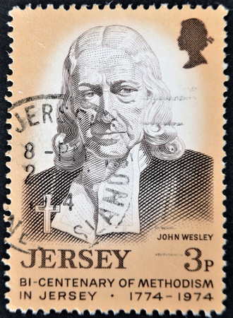 JERSEY - CIRCA 1974: A stamp printed in Jersey dedicated to bi-centenary of methodism in Jersey, shows John Wesley, circa 1974のeditorial素材