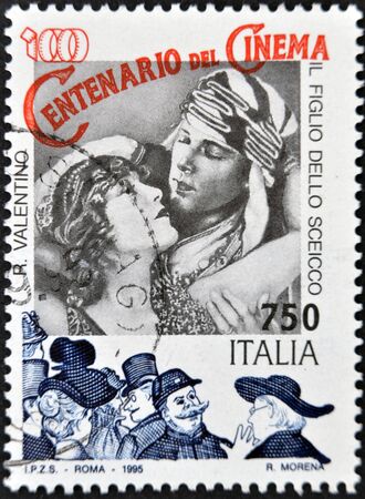 ITALY - CIRCA 1995: A stamp printed in Italy shows Rudolph Valentino in the film The Son of the Sheik, circa 1995のeditorial素材
