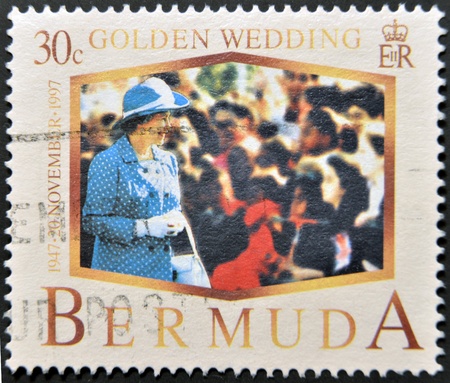BERMUDA - CIRCA 1997: A stamp printed in Bermuda shows Queen Elizabeth II, golden wedding, circa 1997のeditorial素材