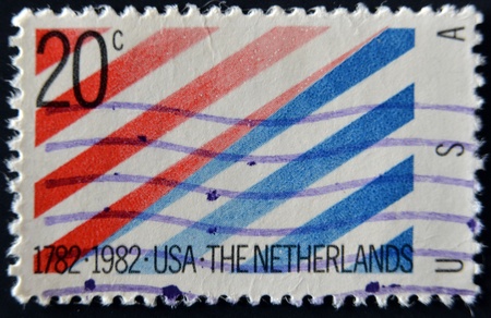 USA - CIRCA 1982: A stamp printed in USA shows a picture of red and blue strips with the words of "1782 1982 USA-The Netherlands" at the bottom, circa 1982 の写真素材