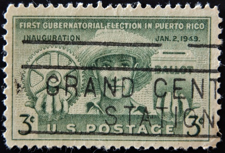 UNITED STATES OF AMERICA - CIRCA 1987: A stamp printed in the USA devoted First Gubernatorial election in Puerto Rico, circa 1987 のeditorial素材