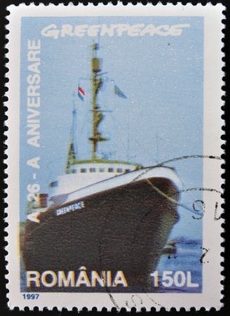 ROMANIA - CIRCA 1997: A stamp printed by Romania, shows Greenpeace, circa 1997 の写真素材