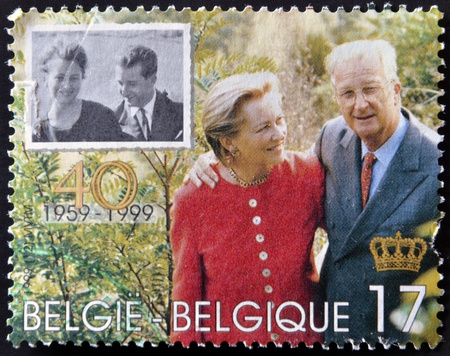 BELGIUM - CIRCA 1999: A stamp printed in Belgium shows the kings, Baudouin I and Fabiola, circa 1999のeditorial素材