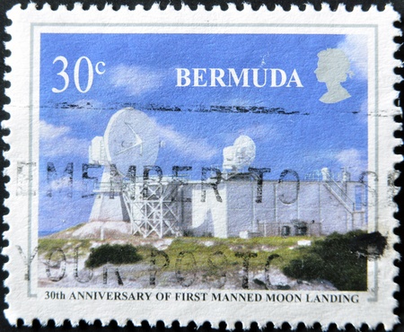 BERMUDA - CIRCA 1986: A stamp printed in Bermuda dedicated to 30th anniversary of first manned moon landing, circa 1986のeditorial素材