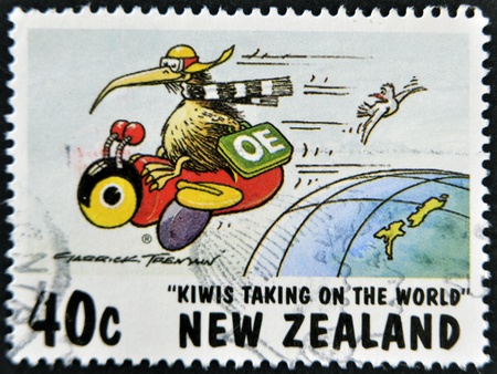 NEW ZEALAND - CIRCA 1997: A stamp printed in New Zealand shows humorous design kiwis taking of the world, circa 1997のeditorial素材