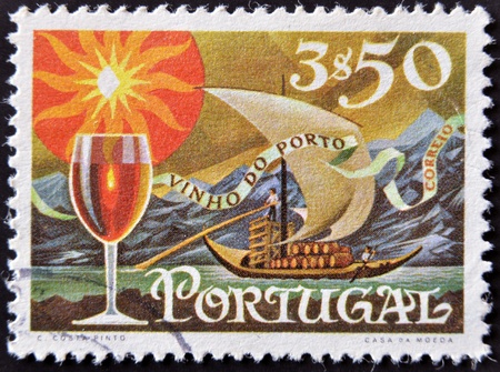 PORTUGAL - CIRCA 1970: A stamp printed in Portugal shows Transfer Port Wine by the River, circa 1970のeditorial素材