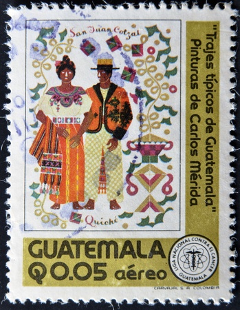 GUATEMALA - CIRCA 1970: A stamp printed in Guatemala shows typical costumes of Guatemala, circa 1970のeditorial素材