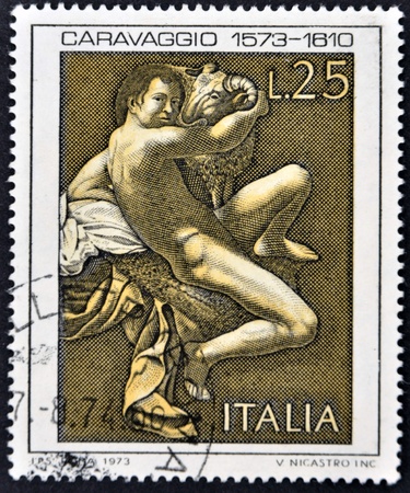 ITALY - CIRCA 1973: A stamp printed in Italy shows the play "Saint John the Baptist" by Caravaggio, circa 1973のeditorial素材